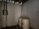 Basement area featuring water tanks and electrical wiring, offering essential utilities and a functional space at 600 Lake Butler Ave, Osteen, FL 32764