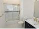 Bathroom featuring a bathtub with shower and vanity with a countertop and blue base at 600 Lake Butler Ave, Osteen, FL 32764