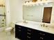 Bathroom with double sinks, shower and tub at 600 Lake Butler Ave, Osteen, FL 32764