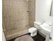 Bathroom featuring a standalone shower, pedestal sink and neutral color palette at 600 Lake Butler Ave, Osteen, FL 32764