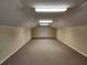 Large bonus room featuring neutral carpet, ample lighting, and flexible layout at 600 Lake Butler Ave, Osteen, FL 32764