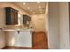 Bright kitchen featuring ample cabinet space, a breakfast bar, and hardwood floors at 600 Lake Butler Ave, Osteen, FL 32764