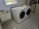 Bright Laundry Room featuring modern Washer and Dryer with utility sink at 600 Lake Butler Ave, Osteen, FL 32764