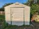Exterior view of a storage shed featuring horizontal siding and a secure door, perfect for storing all your gardening tools at 600 Lake Butler Ave, Osteen, FL 32764
