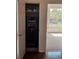Storage closet featuring a Fort Knox safe, with a carpeted room view from the doorway at 600 Lake Butler Ave, Osteen, FL 32764