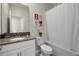 bathroom with shower/tub combination, modern vanity, and framed art at 661 Drop Shot Dr, Davenport, FL 33896