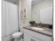 bathroom with shower/tub combination, modern vanity, and framed art at 661 Drop Shot Dr, Davenport, FL 33896