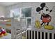 bedroom with bunk beds and a themed wall at 661 Drop Shot Dr, Davenport, FL 33896
