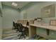 Community business center with computers, desk space, printer, and comfortable seating at 661 Drop Shot Dr, Davenport, FL 33896