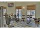 Fitness center featuring modern exercise equipment and large windows for natural light at 661 Drop Shot Dr, Davenport, FL 33896