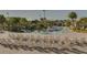 Community lazy river featuring chairs, tables, and palm trees at 661 Drop Shot Dr, Davenport, FL 33896
