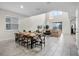 Bright open floor plan with living and dining areas, filled with natural light from large windows at 661 Drop Shot Dr, Davenport, FL 33896