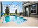 Relaxing screened-in pool and backyard overlooking the water at 661 Drop Shot Dr, Davenport, FL 33896