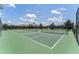 Tennis courts offering residents outdoor recreational activities in a private community at 661 Drop Shot Dr, Davenport, FL 33896