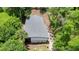 An aerial view showcases the property's roof and surrounding lush greenery at 722 Carlson Dr, Orlando, FL 32804