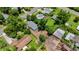 Aerial view of a home with gray roof surrounded by mature trees, showing neighborhood context at 722 Carlson Dr, Orlando, FL 32804