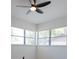 Bright bedroom featuring two windows with plenty of natural light and a ceiling fan at 722 Carlson Dr, Orlando, FL 32804