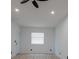 Bright bedroom with recessed lighting, ceiling fan, wood floor, and one bright window at 722 Carlson Dr, Orlando, FL 32804