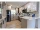 Modern kitchen with stainless steel appliances, stylish cabinetry, and marble countertops at 722 Carlson Dr, Orlando, FL 32804