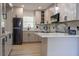 Modern kitchen featuring stainless steel appliances, marble countertops and modern pendant lighting at 722 Carlson Dr, Orlando, FL 32804