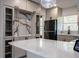 Spacious kitchen featuring white marble countertop and stainless steel appliances and hardware at 722 Carlson Dr, Orlando, FL 32804