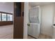 Convenient laundry area with stacked washer and dryer unit and lots of natural light at 722 Carlson Dr, Orlando, FL 32804
