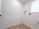 Utility room with a bright window and access for a washer and dryer at 722 Carlson Dr, Orlando, FL 32804
