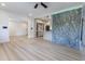 Bright, open-concept living room with updated kitchen featuring modern cabinets and marble countertops at 722 Carlson Dr, Orlando, FL 32804