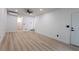 Large living room with wood floors, and entryway to a bathroom and backyard at 722 Carlson Dr, Orlando, FL 32804