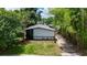 An aerial view of the rear of the property shows the home's layout and landscaping at 722 Carlson Dr, Orlando, FL 32804