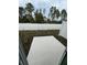 Fenced backyard features a concrete patio and a lawn, perfect for outdoor entertaining at 7717 Stone Creek Trl, Kissimmee, FL 34747