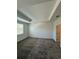Large bedroom with tray ceiling, carpet flooring and abundant natural light at 7717 Stone Creek Trl, Kissimmee, FL 34747