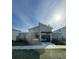 Modern community building with attractive landscaping and an inviting entrance gate at 7717 Stone Creek Trl, Kissimmee, FL 34747