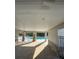 Shaded poolside area offers a relaxing retreat with stone pillars and comfortable seating at 7717 Stone Creek Trl, Kissimmee, FL 34747