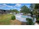 Aerial view of the property with the pool, hot tub and a lush, tropical oasis at 7900 S Orange Blossom Trl # 2074, Orlando, FL 32809
