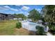 Aerial view of the property with the pool, hot tub and a lush, tropical oasis at 7900 S Orange Blossom Trl # 2074, Orlando, FL 32809