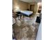 Cozy bedroom featuring tile flooring, a comfortable bed, and a well-equipped kitchenette at 7900 S Orange Blossom Trl # 2074, Orlando, FL 32809