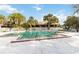 Large community pool with ample seating, mature trees, and a well-maintained deck for outdoor enjoyment at 7900 S Orange Blossom Trl # 2074, Orlando, FL 32809
