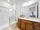 Bathroom featuring a shower, tile floor and a wood vanity at 9071 Woodland Forest Rd, Orlando, FL 32836