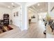Bright foyer featuring hardwood floors, neutral paint, and seamlessly flowing into the dining and living areas at 9071 Woodland Forest Rd, Orlando, FL 32836