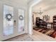 Inviting home office space with a large desk, bookshelves, and natural light at 9071 Woodland Forest Rd, Orlando, FL 32836