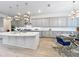 Kitchen with granite counters, stainless steel appliances, custom cabinets and a breakfast area at 9071 Woodland Forest Rd, Orlando, FL 32836