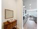 Kitchen area with stainless steel appliances, custom cabinets, hardwood floors and an adjacent dining area at 9071 Woodland Forest Rd, Orlando, FL 32836