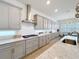 Gourmet kitchen featuring granite countertops, stainless steel appliances, and custom cabinets at 9071 Woodland Forest Rd, Orlando, FL 32836