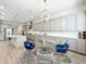 Open concept kitchen with stainless steel appliances, large island, and an adjacent breakfast area at 9071 Woodland Forest Rd, Orlando, FL 32836