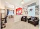 Cozy living room featuring leather chairs, carpeted flooring, and decorative accents at 9071 Woodland Forest Rd, Orlando, FL 32836