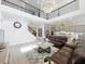 Great room featuring an open layout, a loft, kitchen, an adjacent kitchen and stylish furnishings at 9071 Woodland Forest Rd, Orlando, FL 32836