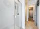 Modern tiled shower with frameless glass enclosure and chrome fixtures at 9071 Woodland Forest Rd, Orlando, FL 32836
