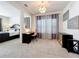 Sitting room with desk, decorative light fixture and view to the bedroom at 9071 Woodland Forest Rd, Orlando, FL 32836