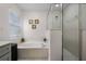Bathroom features a large soaking tub and a separate glass-enclosed shower at 909 Troon Cir, Davenport, FL 33897